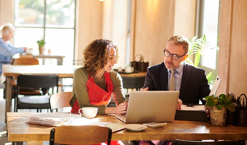 Small business owner reviewing business insurance coverage